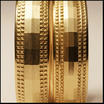 A 5mm gold wedding band with faceted milgrain detailing in 9ct gold, shown against a black background by Majestic Jewellery.