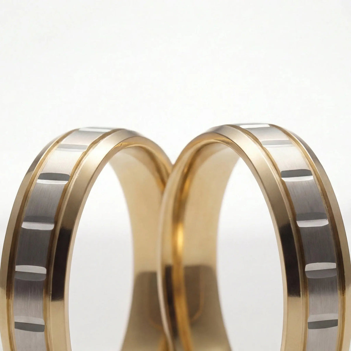 A 5mm gold wedding band with a star cut design in two-tone 9ct, 14ct, and 18ct gold by Majestic Jewellery