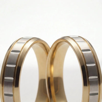 A 5mm gold wedding band with a star cut design in two-tone 9ct, 14ct, and 18ct gold by Majestic Jewellery