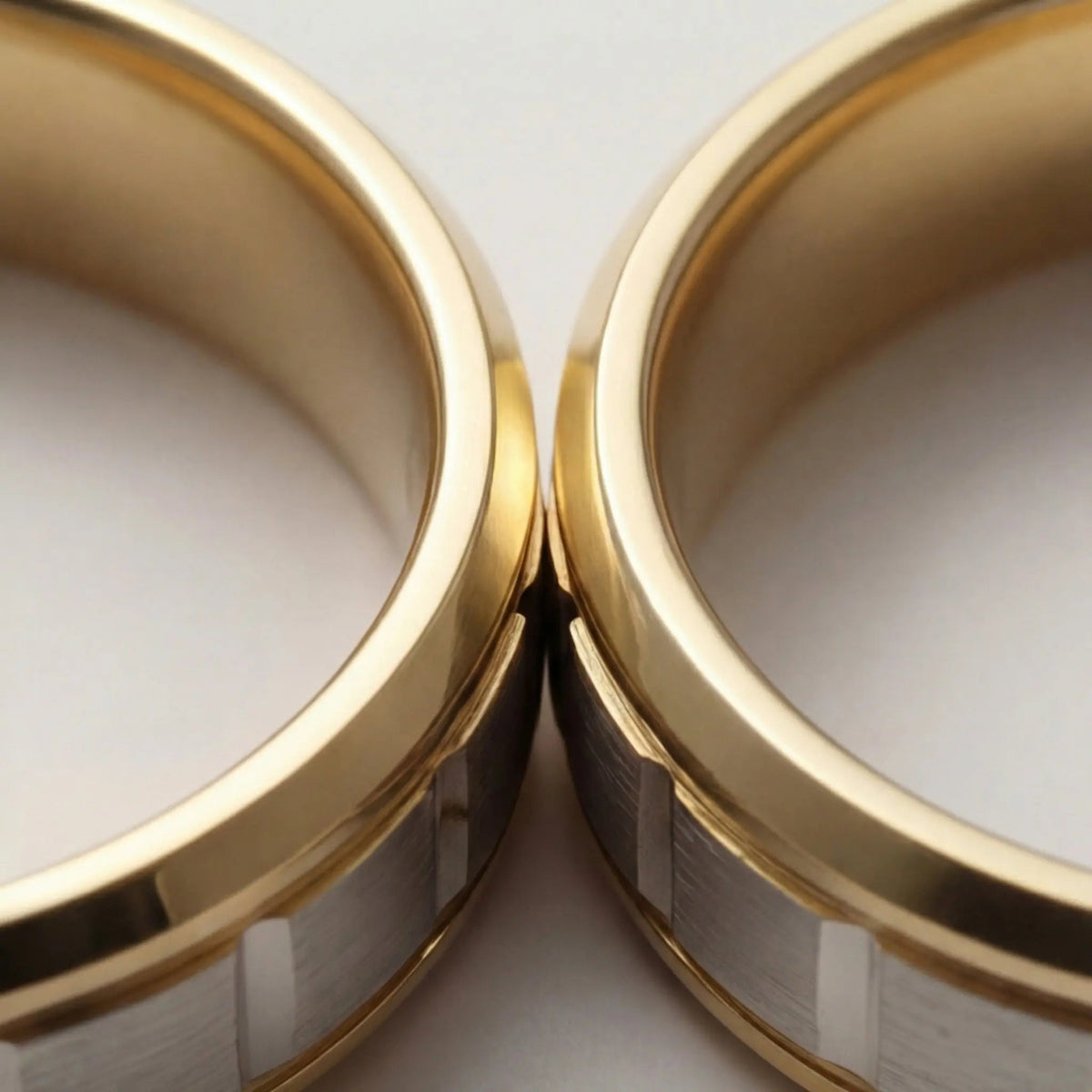 A 5mm gold wedding band with a star cut design in two-tone 9ct, 14ct, and 18ct gold by Majestic Jewellery