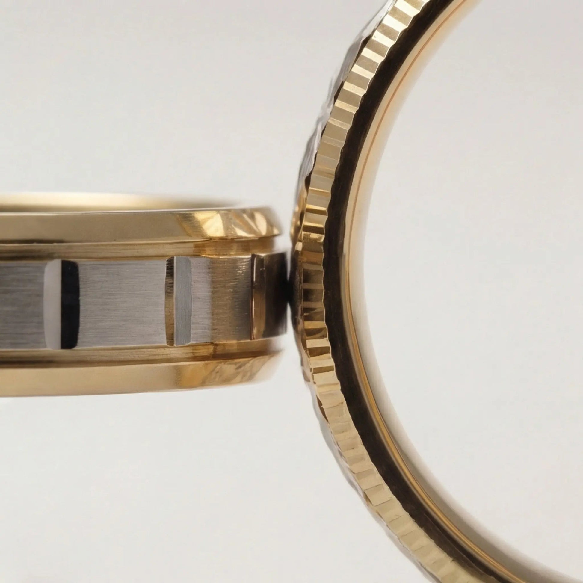 A 5mm gold wedding band with a star cut design in two tone 9ct, 14ct, and 18ct gold by Majestic Jewellery.
