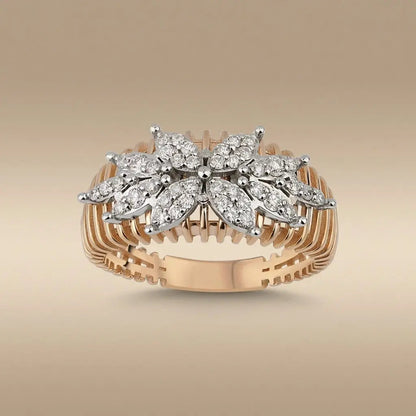 A 14ct gold floral cluster diamond ring with natural diamonds set in a delicate design by Majestic Jewellery.