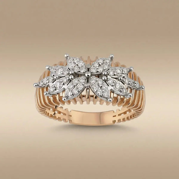 A 14ct gold floral cluster diamond ring with natural diamonds set in a delicate design by Majestic Jewellery.