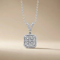 A square cluster of natural diamonds set in 14k white gold pendant worn on a chain by Majestic Jewellery.