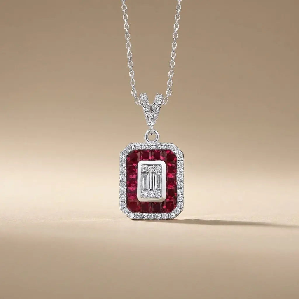 14ct white gold ruby and diamond pendant with a ruby halo and baguette diamond 0.31ct by Majestic Jewellery