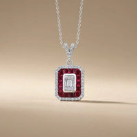 14ct white gold ruby and diamond pendant with a ruby halo and baguette diamond 0.31ct by Majestic Jewellery