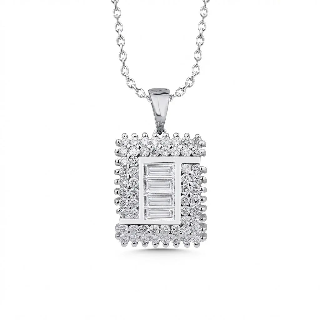 A 14ct white gold pendant featuring a square baguette diamond center with 1.03ct, displayed on a chain by Majestic Jewellery.