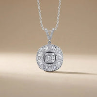 A 14ct white gold diamond pendant with a baguette halo and 0.74ct circle diamonds by Majestic Jewellery
