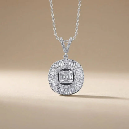 A 14ct white gold diamond pendant with a baguette halo and 0.74ct circle diamonds by Majestic Jewellery