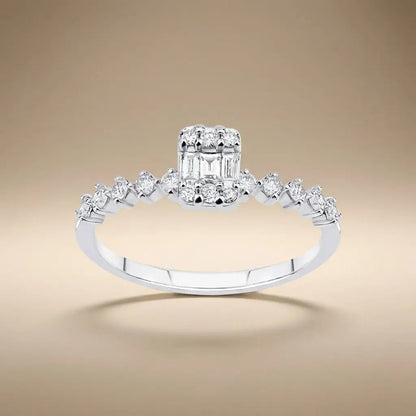 14ct white gold ring with baguette diamond cluster and 0.34ct accents worn on a finger by Majestic Jewellery