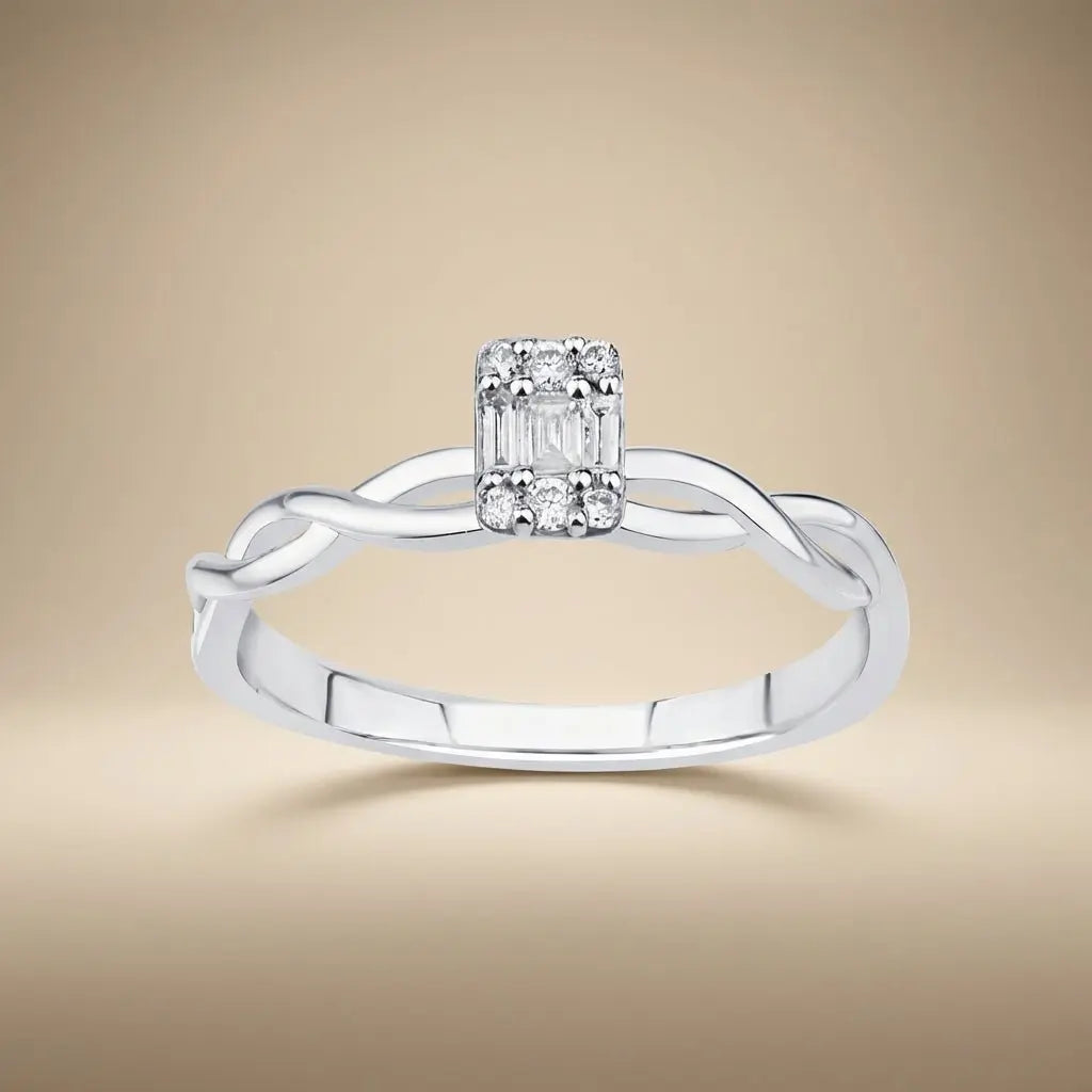14ct white gold twisted baguette diamond ring with 0.12ct natural diamonds worn on a finger by Majestic Jewellery