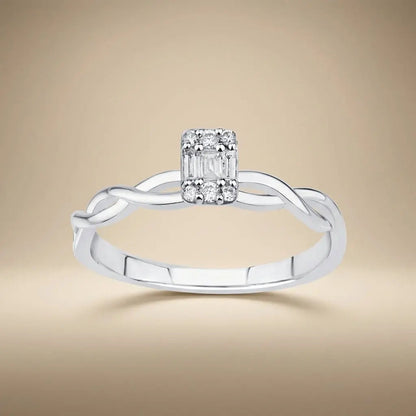 14ct white gold twisted baguette diamond ring with 0.12ct natural diamonds worn on a finger by Majestic Jewellery