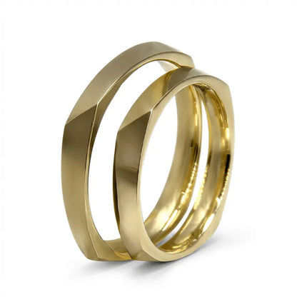 A 3mm faceted gold wedding band in 9ct gold, displayed on a white background with a subtle texture and reflective surface.