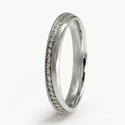 A 3mm gold wedding band with a diamond line design in 9ct gold, shown against a soft background, by Majestic Jewellery.