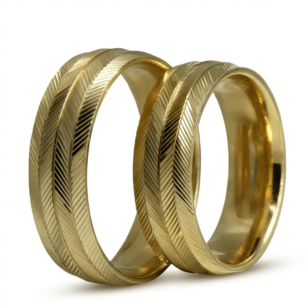 A 6mm gold wedding band with a heritage cut design in 9ct gold, shown against a soft background by Majestic Jewellery.
