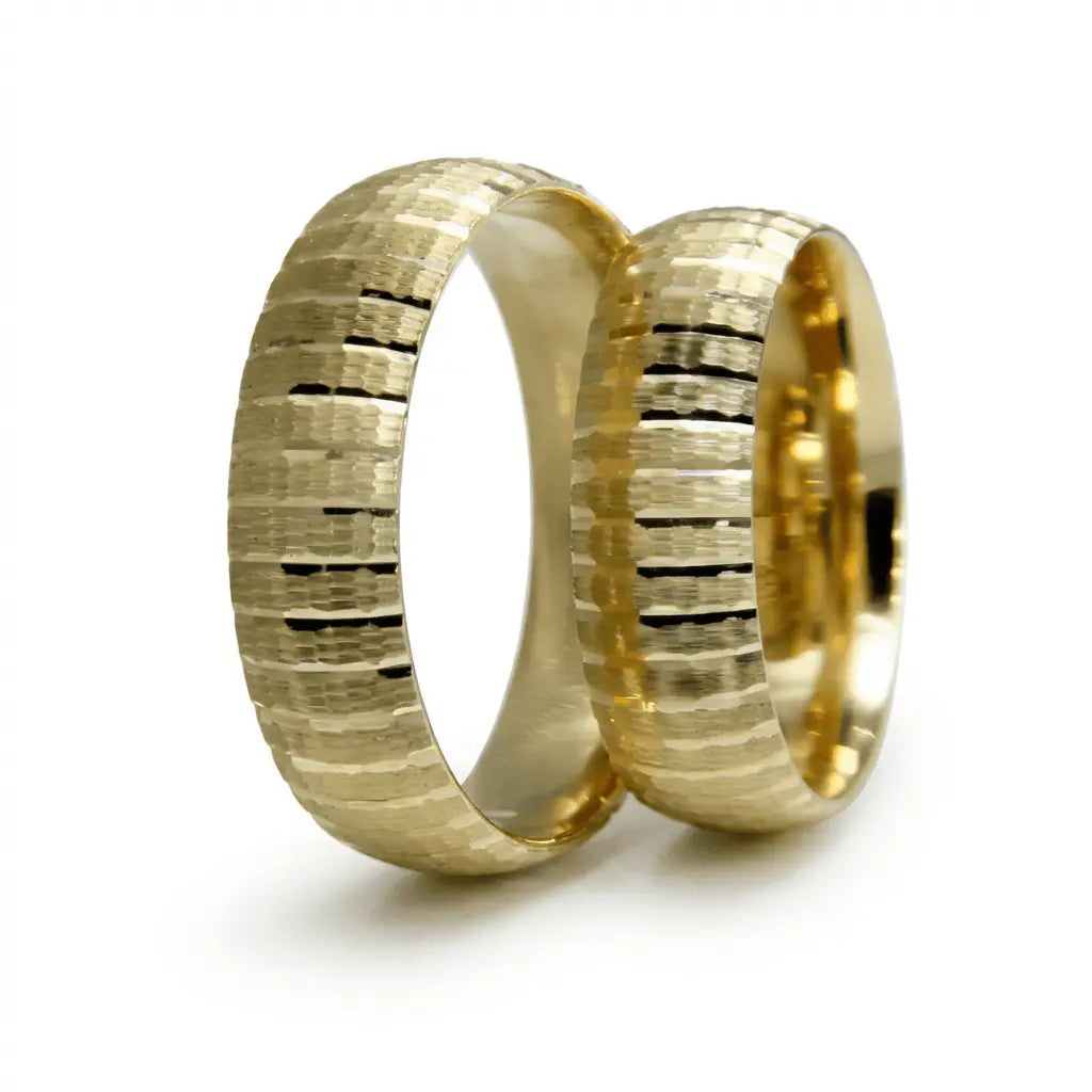 A 6mm gold wedding band with layered texture strata in 9ct gold, shown against a soft background by Majestic Jewellery.