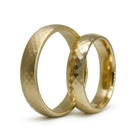 A 5mm gold wedding band with hexa faceted design in 14ct gold, shown against a black background by Majestic Jewellery.