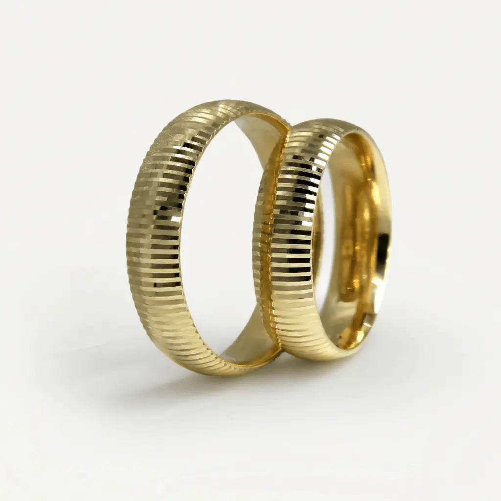 A 5mm gold wedding band with vertical ribs in 9ct, 14ct, or 18ct gold, displayed on a soft background by Majestic Jewellery.