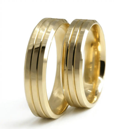 A 5mm gold wedding band with triple line design in 9ct gold, shown against a black background by Majestic Jewellery.