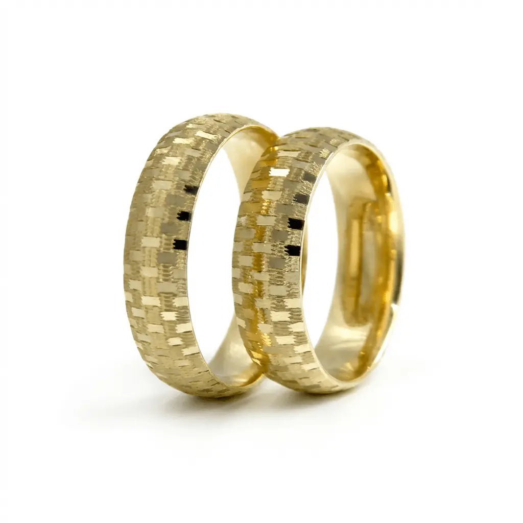 A 6mm gold wedding band with a mosaic texture in 9ct gold, shown against a neutral background by Majestic Jewellery.