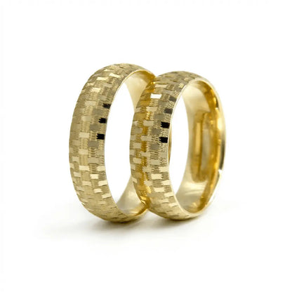 A 6mm gold wedding band with a mosaic texture in 9ct gold, shown against a neutral background by Majestic Jewellery.