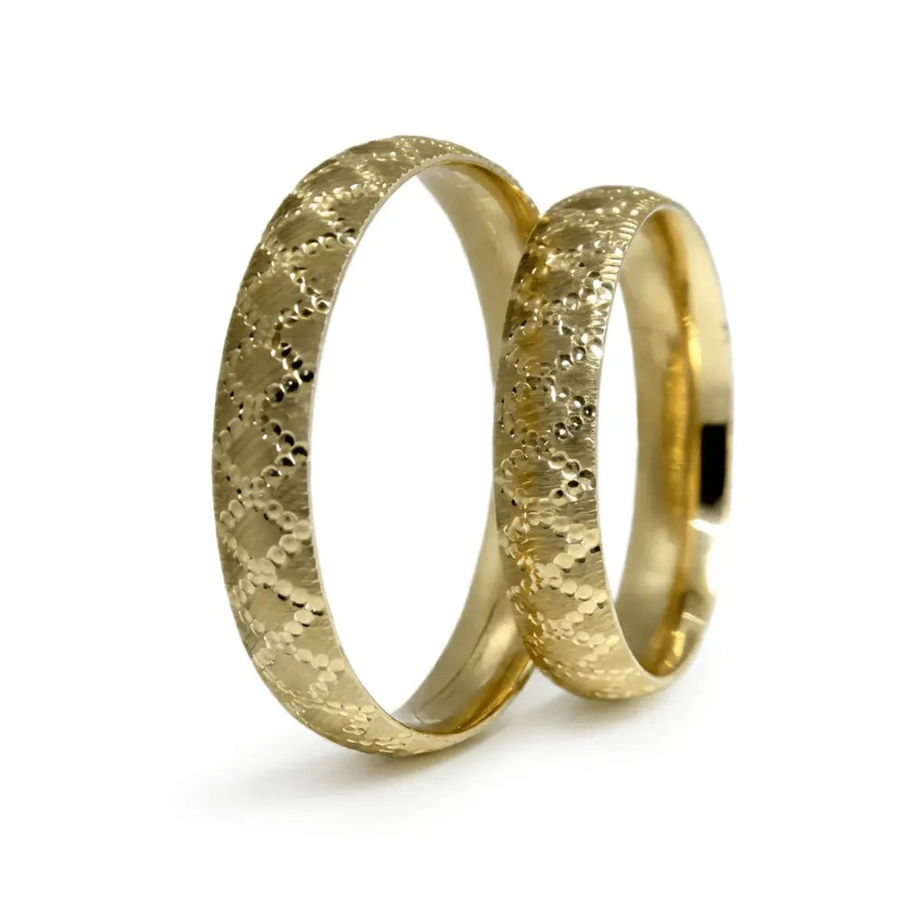 A 4mm gold wedding band with a lattice design in 9ct gold, shown against a neutral background by Majestic Jewellery.