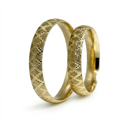A 4mm gold wedding band with a lattice design in 9ct gold, shown against a neutral background by Majestic Jewellery.