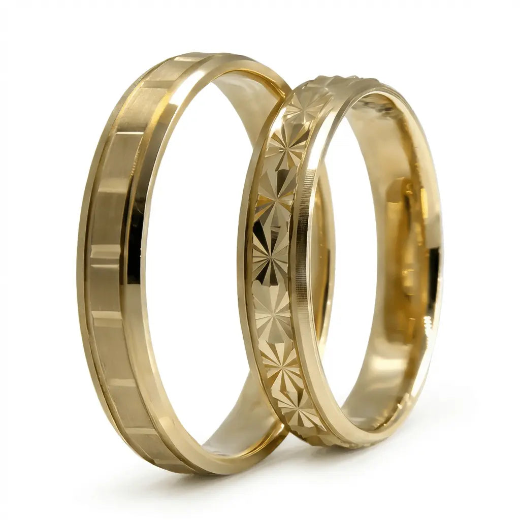 A 4mm gold wedding band with a starburst faceted design in 9ct gold, shown against a black background by Majestic Jewellery.