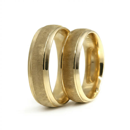 A 6mm brushed satin gold wedding band in 9ct gold, displayed horizontally with a subtle metallic sheen, by Majestic Jewellery