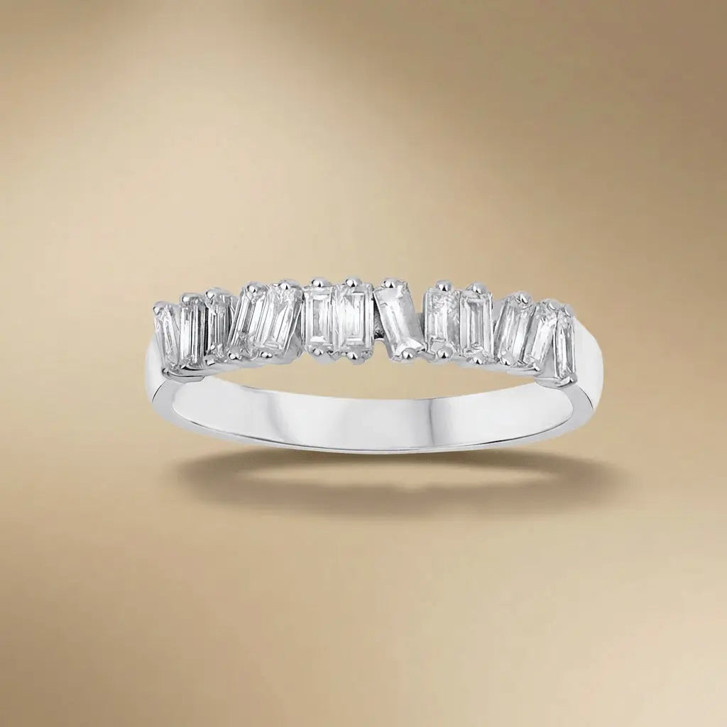 A 14ct white gold ring with a 0.36ct baguette diamond set in a solitaire design by Majestic Jewellery.