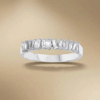 A 14ct white gold ring with a 0.36ct baguette diamond set in a solitaire design by Majestic Jewellery.