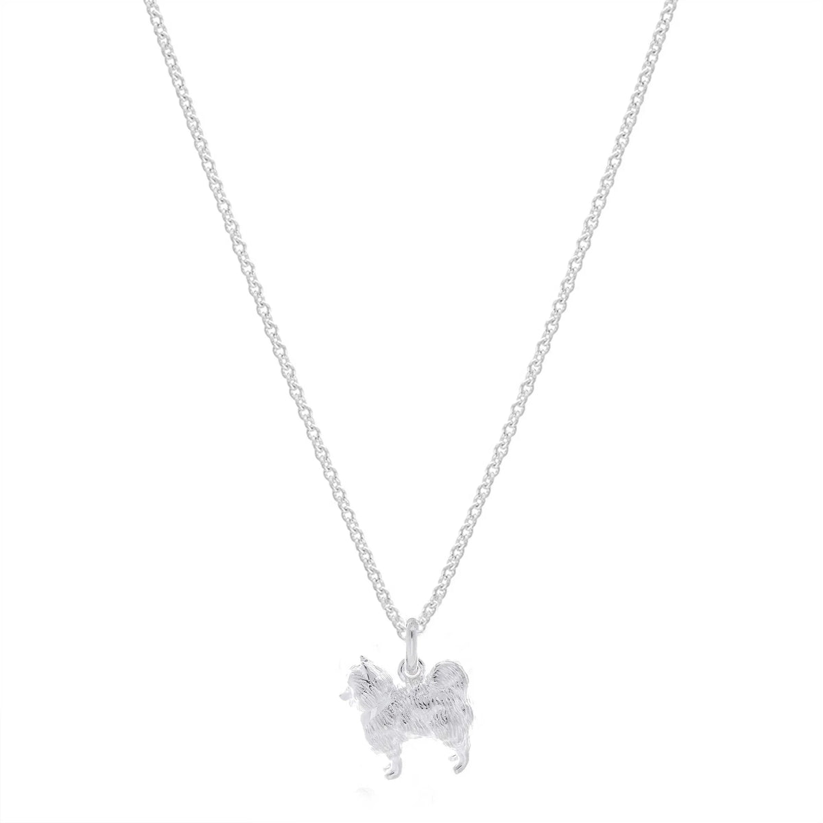 A silver Pomeranian dog charm shaped like a small paw print, detailed with delicate engravings, by Scarlett Jewellery.