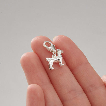 Silver Jack Russell Terrier dog charm by Scarlett Jewellery displayed on a soft fabric background