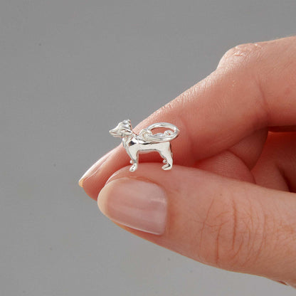 Silver Jack Russell Terrier dog charm by Scarlett Jewellery displayed on a soft fabric background