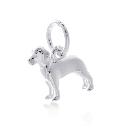A silver Labrador dog charm shaped like a loyal companion, displayed on a soft blue background, by Scarlett Jewellery.