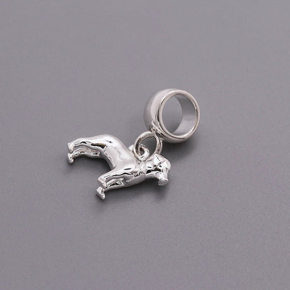 A silver Labrador dog charm shaped like a paw print, displayed on a white background with a soft texture, by Scarlett Jewelle