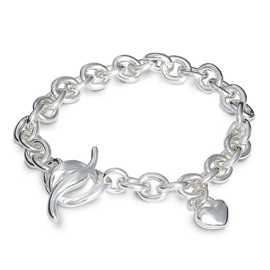 A silver heart charm bracelet with a detailed textured finish, featuring a central heart pendant, by Scarlett Jewellery.
