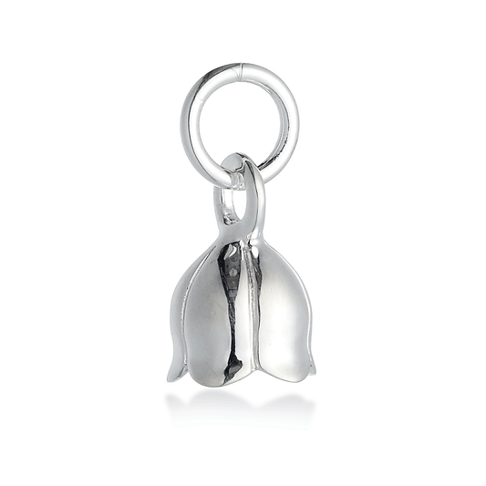 A silver lily of the valley flower charm with delicate detailing, displayed on a soft pink background by Scarlett Jewellery.