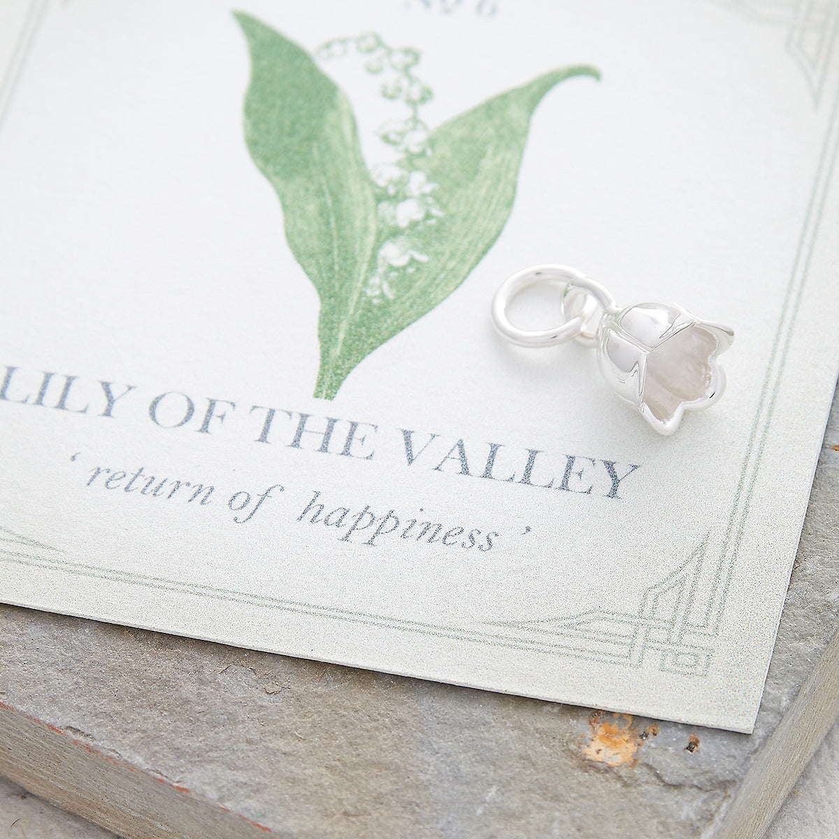 Silver lily of the valley flower charm with delicate details by Scarlett Jewellery.