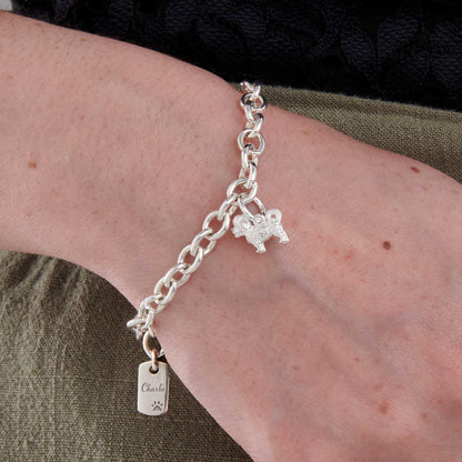 Silver dog charm bracelet featuring a Maltipoo design by Scarlett Jewellery.