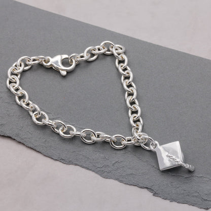 Silver charm bracelet with personalized mortar board charm by Scarlett Jewellery