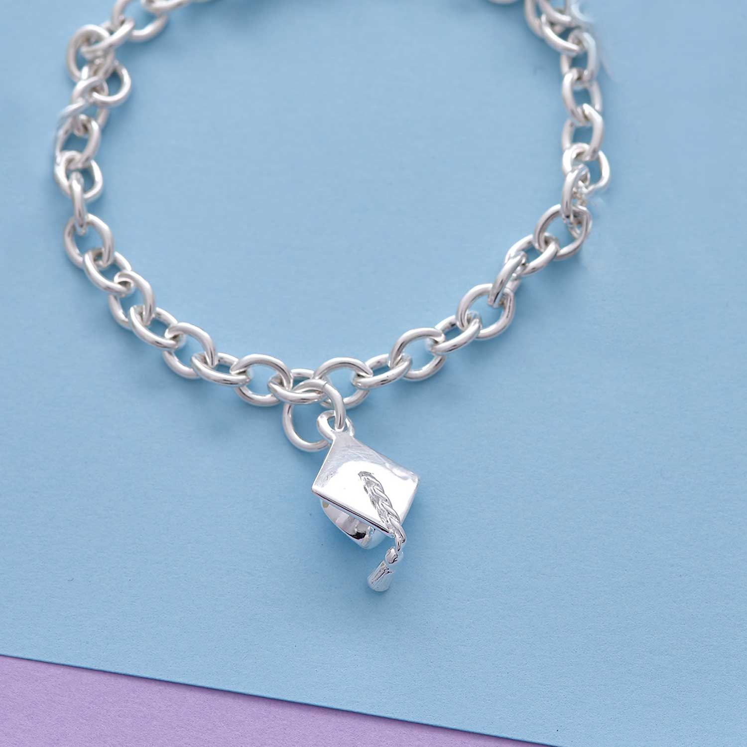 Silver charm bracelet with personalized mortar board charm by Scarlett Jewellery