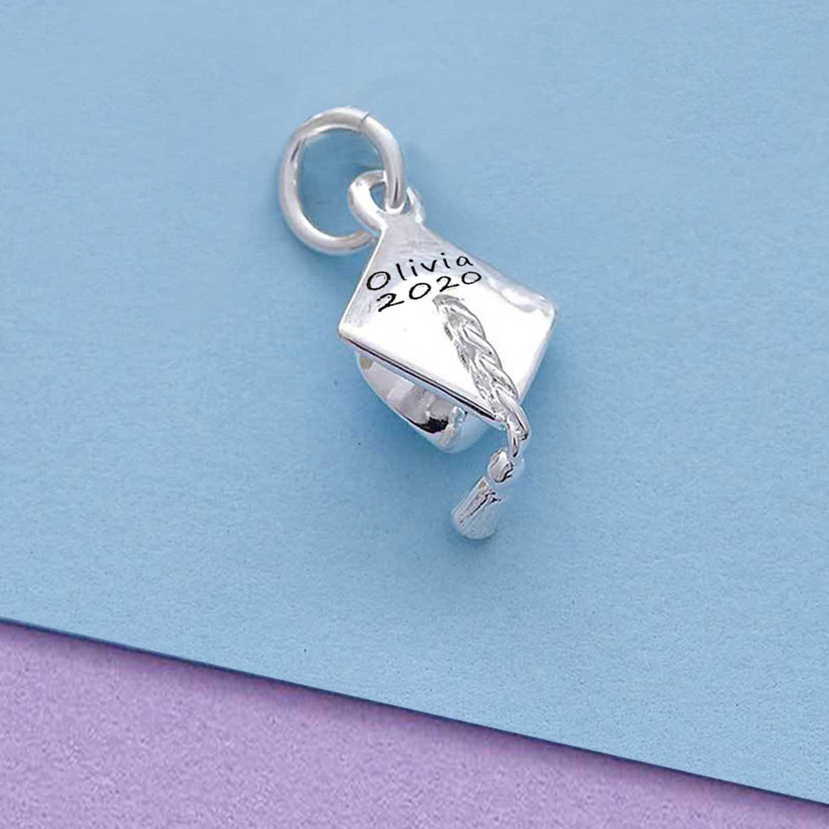 Silver charm bracelet with personalized mortar board charm by Scarlett Jewellery.
