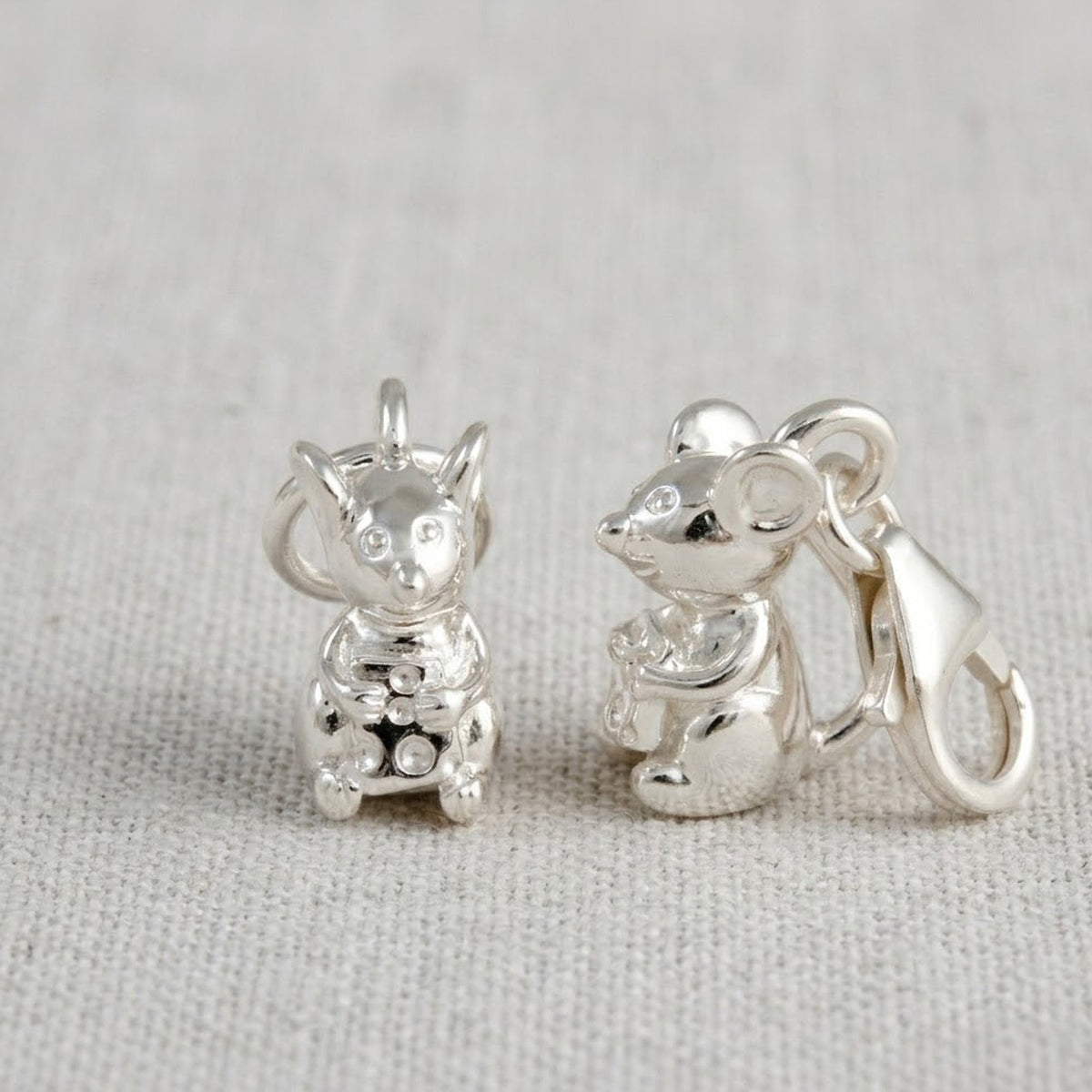 Silver mouse charm with detailed texture and intricate design by Scarlett Jewellery.