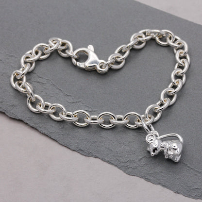 Silver mouse charm with detailed texture, displayed on a soft background, by Scarlett Jewellery.