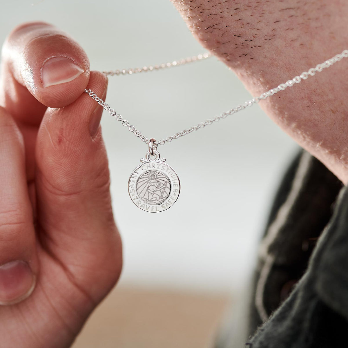 Silver St Christopher pendant on a chain with personalized engraving, front view by Scarlett Jewellery.