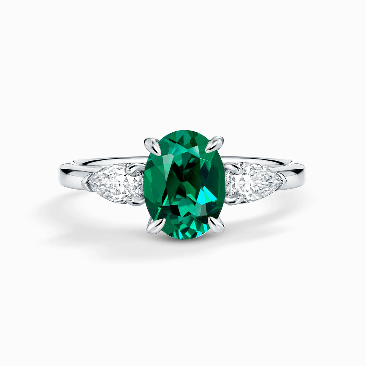 Emerald Oval Cut Three Stone Engagement Ring in Sterling Silver - SJR London Timepiece