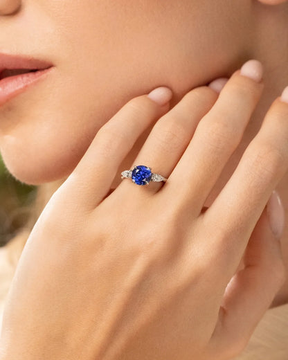Blue Sapphire Round Cut Three Stone Engagement Ring in Sterling Silver - SJR London Timepiece