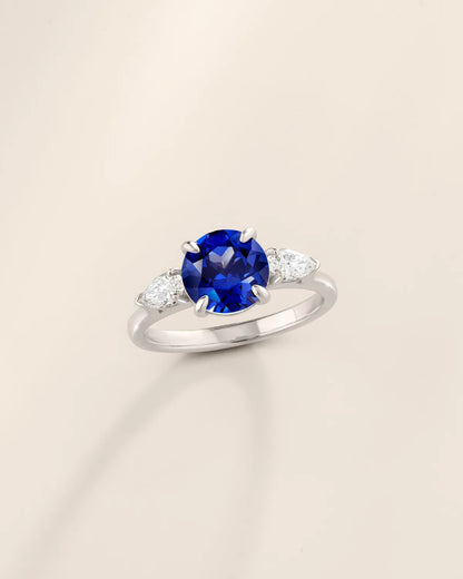 Blue Sapphire Round Cut Three Stone Engagement Ring in Sterling Silver - SJR London Timepiece
