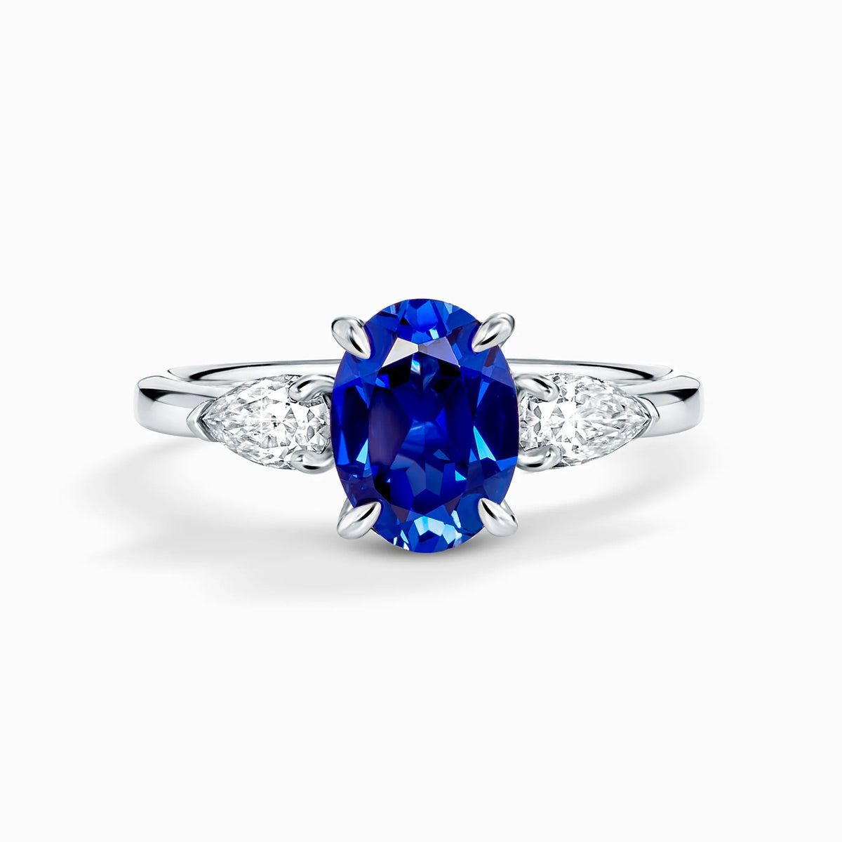 Blue Sapphire Oval Cut Three Stone Engagement Ring in Sterling Silver - SJR London Timepiece